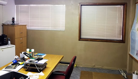 Here is the office after installation of Venetian Office blinds. The blinds blocks out the direct sunlight and insures privacy for this office worker.